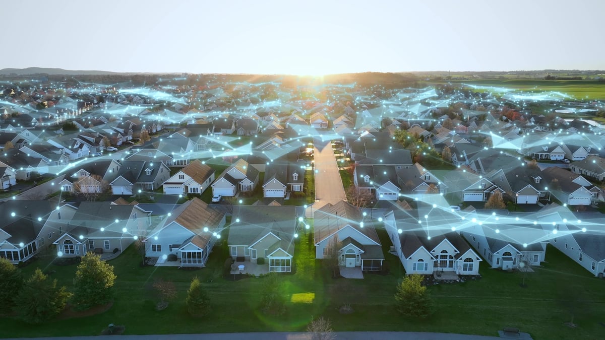 Aerial view of an American neighborhood at golden hour showing connections between homes